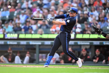 Holliday's 4 hits, Orioles' 3 homers leads to an 8-5 victory over the Tigers